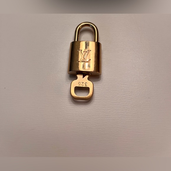 Authentic Louis Vuitton padlocks with single key. 302 and 320 are sold. - Picture 2 of 4